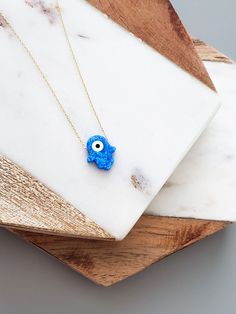 "14k Solid Gold Opal Blue Hamsa Hand Necklace - 14k Gold Evil Eye Necklace - 14k Opal Blue Evil Eye Pendant Necklace - Fine Jewelry for Women The Solid Gold Opal Hamsa Hand Evil Eye Necklace \"Protection\" for Women is composed of high-quality 14 Karat Gold. The Hamsa Hand figure is the most preferred amulet for eliminating bad energy. Destroying the effects of bad looks, it offers a simple yet beautiful detail on your neck. 🔳WARRANTY🔳 *6 Months warranty. *Free Shipping without price limit. *E Blue 14k Gold Necklaces For Anniversary, 14k Gold Jewelry With Lobster Clasp For Gift, Blue 14k Gold Necklace For Anniversary, Yellow Gold Evil Eye Jewelry For Anniversary, 14k Yellow Gold Evil Eye Necklace, Spiritual 14k Gold Charm Necklace For Gift, 14k Gold-filled Necklace With Lobster Clasp For Gift, 14k Gold Necklace With Lobster Clasp As Gift, Spiritual Yellow Gold Jewelry For Birthday Gift