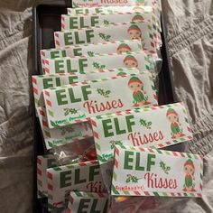 elf themed candy wrappers in a suitcase