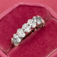 three stone diamond ring in pink velvet case