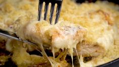 a fork with some food in it on a pan and is being lifted from the casserole