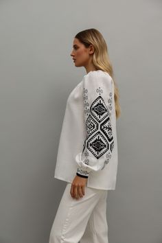 Traditional Long Sleeve Linen Tops, Folk Style Linen Top With Floral Embroidery, Folk Style Embroidered Linen Top, Embroidered Linen Folk Tops, Folk Style Long Sleeve Linen Tops, Folk Style Embroidered Top With Woven Motifs, Bohemian White Blouse With Embroidered Cuffs, White Bohemian Blouse With Embroidered Cuffs, Traditional Linen Blouse With Floral Embroidery