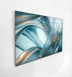 an abstract blue and gold painting hanging on the wall