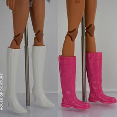 two dolls standing next to each other wearing pink and white boots with metal poles in front of them