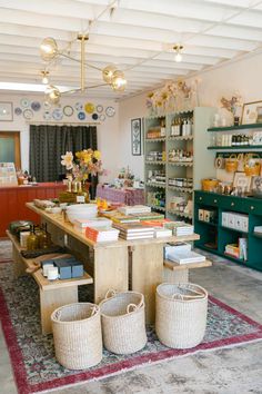 the inside of a store with baskets on the floor