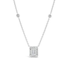 Classic, simple, and chic — this rectangular pendant features round-cut and baguette diamonds set to appear as one glittering emerald cut solitaire. Bezel-set diamonds on its cable chain enhance the piece’s elegant sparkle.- 18K gold weighing 5.55 grams - 12 round diamonds totaling 0.34 carats - 6 straight baguettes totaling 0.93 carats Available in yellow, white, and rose gold. Please allow 4-6 weeks for delivery if item is not in stock. Item no. N09451 Diamond Necklace With Rectangular Pendant, Rectangular Diamond Cut Diamond Necklace, Classic Jewelry With Baguette Diamonds In Rectangular Shape, Rectangular Pendant With Baguette Diamonds, Baguette Cut Solitaire Diamond Necklace, Baguette Cut Diamond Solitaire Necklace, White Gold Emerald Cut Baguette Diamond Necklaces, Anniversary Diamond Necklace With Rectangular Pendant, Rectangular Diamond Cut Necklace