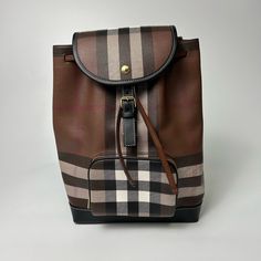 Burberry Check And Leather Backpack In Dark Birch Brown Original Tags Included Dust Bag Included Small Imperfection On Strap (See Pictures) 13 Inches High 10 Inches Wide 5.5 Inches Deep Burberry Backpack Women, Luxury Brown School Bag, Designer Brown Backpack Bags, Designer Brown Standard Backpack, Luxury Coated Canvas Backpack For Errands, Designer Brown Backpack For School, Luxury Brown Backpack For School, Luxury Brown School Backpack, Designer Brown Backpack