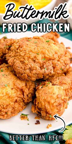 some fried chicken on a white plate with the words buttermik fried chicken