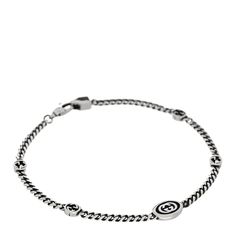 This is an authentic GUCCI Sterling Silver Enamel Thin Interlocking G Bracelet in Black. The bracelet is crafted of sterling silver and features Gucci interlocking G motifs stationed on a polished curb link chain. Bracelet Black, Silver Enamel, Link Chain, Gucci, Bracelet, Sterling Silver, Chain, Silver, Black