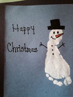 a snowman made out of paper with the words happy christmas written on it