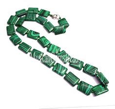 green and white glass beaded necklace on a silver plated chain with a clasp