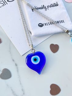 Handmade and one of a kind. Straight from the MediterraneanSea. The gorgeous BEAUTIFUL one of a kind Glass Evil Eye heart amulets will reflect any negative energy with its striking eye. A traditional yet timeless necklace curated for the modern fashionista. Chain Necklaces are 16kt gold plated over brass measuring a 17.5 inch length. This chain is higher quality than my usual charm chains. I had to upgrade it for this unique statement charm. Limited quantities special made for Valentine's Day. T Spiritual Blue Jewelry With Heart Charm, Unique Blue Keepsake Necklace, Blue Spiritual Heart Pendant Jewelry, Blue Amulet Necklace For Good Luck, Blue Heart-shaped Spiritual Necklace, Spiritual Blue Heart Pendant Jewelry, Spiritual Blue Heart Pendant Necklace, Unique Evil Eye Necklace For Gift, Blue Necklace With Heart Charm