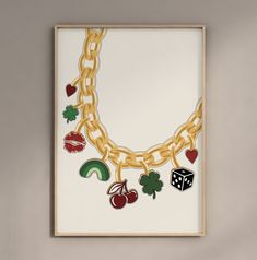 an art piece is hanging on the wall with many different items attached to it's chains