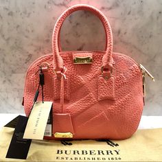 Burberry Check Small Orchard Bag - New With Tags And Dust Bag - Color: Rose Pink - Dimensions: 12”L X 9.75”H X 3.75”W - Burberry Check Grained Leather - Double Zip Closure - Removable Adjustable Shoulder Strap - Gold Hardware - Inner Pocket With Zip Closure - Two Open Inner Pockets Reasonable Offers Only Please! Luxury Pink Pouch-shaped Satchel, Luxury Pink Pouch Satchel, High-end Pink Satchel With Detachable Handle, Designer Pink Bag For Formal Occasions, Designer Pink Satchel With Gold-tone Hardware, Designer Pink Satchel With Handle Drop, Designer Pink Satchel For Formal Occasions, Small Orchard, Rose Pink