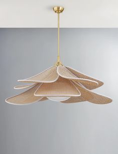 the light fixture is made from woven material and has five lights hanging from it's sides