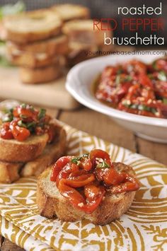 toasted red pepper bruschetta is on a yellow and white towel next to some bread