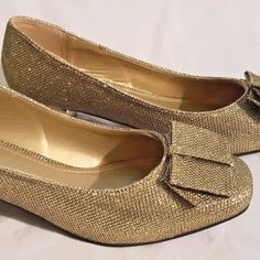 New By Glamour Gold Textured Sparkling Fabric Round Toe With Bow Accent 1.75 In. Gold Trimmed Heel 7.5m **We Have Closed Our Boutique So Our Shoes May Or May Not Be Shipped In Original Box** Gold Classic Heels For Party, Gold Low Heel Holiday Heels, Gold Holiday Heels With Low Heel, Gold Sparkling Low Heel Shoes, Gold Embellished Low Heel Heels, Gold Court Shoes With 4-inch Heel And Round Toe, Luxury Low Heel Heels With Gold-tone Hardware, Gold Kitten Heels With 4-inch Heel For Formal Occasions, Evening Shoes