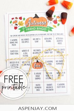 a free printable autumn friend bingo game with candy candies around it and an orange ribbon