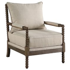 the arm chair is made from wood and has a beige linen upholstered cushion