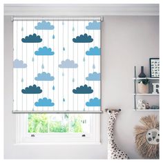 a child's bedroom with blue clouds and raindrops on the window