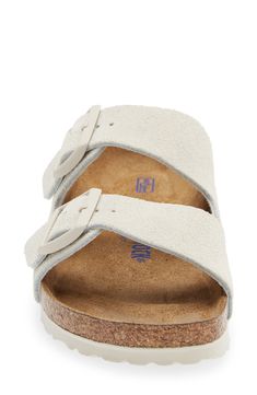 This slide sandal pairs a duo of buckled straps with a contoured footbed that mimics the shape of the foot with excellent support. Adjustable straps with buckle closures Cushioned footbed with arch support Leather upper and lining/synthetic sole Imported Suede Slide Sandals With Buckle Closure, Suede Open Toe Footbed Sandals With Buckle Closure, Adjustable Buckle Closure Slip-on Sandals, Suede Slides With Buckle Closure And Round Toe, Suede Slides With Buckle Closure For Beach, Adjustable Buckle Closure Footbed Sandals, Adjustable Double Strap Slides With Cushioned Footbed, Comfortable Adjustable Footbed Sandals With Buckle, Adjustable Double Strap Footbed Sandals With Buckle