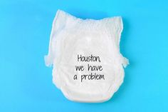 a diaper with the words houston, we have a problem written on it against a blue background