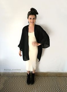 Handmade black sheer kimono robe cardigan robe. This version of our kimono shirts is lovingly crafted in a flattering wide and loose style, one-size-fits all. Made in a black sheer see through light viscose fabric that is light and floaty and easy to wear. The square shaped oversize fit is complimented with wide arm quarter length sleeves and a longer back panel for a more flattering fit. Pictured is our knee length version, but this kimono cardigan can be customised to your desired length. Plea Black Kimono With Kimono Sleeves For Party, Black Summer Party Kimono, Black Wrap Kimono For Spring, Black Long Kimono For Party, Chic Long Black Kimono, Long Black Party Kimono, Black Open Front Kimono, Black Open Front Kimono For Spring, Chic Black Kimono For Party