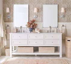 a bathroom with two sinks and mirrors on the wall