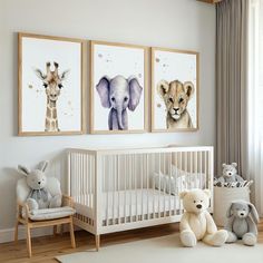 a baby's room with three pictures on the wall