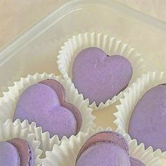 purple heart shaped pastries in a plastic container