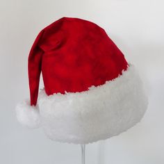 "This festive Santa hat is made up in a cozy red flannel tie dye cotton fabric. Great novelty party hat. Hat is made in the traditional cone style stocking cap for Santa. Red tie dye flannel is accented with a white faux Sherpa fur fabric trim. Proportions of the hat are generous and will fit most head sizes, ladies or gents. Hat is a soft slouch cone style. Great Santa hat for that hippie at heart. Measurement for opening for your head is 25\" circumference and the length is 18\". There is a sn Oversized Santa Hat, Red Christmas Party Costume Hat, Cheap Red Holiday Hats, Tie Dye Christmas, Red Adjustable Christmas Hat, Christmas Party Hat, Novelty Red Winter Hat, Flannel Tie, Christmas Party Hats