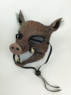 Handmade resin Wild Boar costume mask. Creepy Hog mask for Halloween or theatrical production. Durable resin, Comfortable & lightweight, will fit adult, teen and child. One available, ready to ship. Stunning handcrafted Hog Mask, perfect for theatre and ballet, specifically designed for the stage. Professional, full-face, costume mask. Realistic Boar face, sculpted with fur texture, menacing tusks and large ears with faux fur.  Key Features: ★ 3 way, adjustable elastic straps ensure a secure fit Adjustable Masks And Prosthetics For Halloween Costume Party, Adjustable Masks For Halloween Costume Party, Novelty Halloween Masks And Prosthetics For Costume Party, Themed Halloween Masquerade Masks And Prosthetics, Themed Masks For Halloween Costume Party, Funny Halloween Costume Accessories, Themed Masquerade Masks And Prosthetics For Halloween, Halloween Themed Costume Party Masks, Themed Halloween Masks For Costume Party