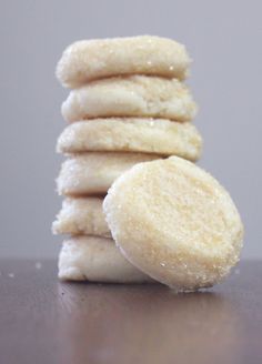 a stack of white cookies sitting on top of a table