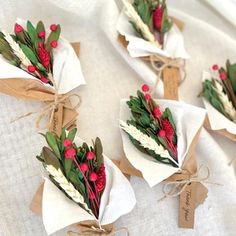 flowers are wrapped in brown paper and tied with twine on top of each other