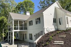 a large white house sitting on top of a hill