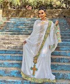 This traditional Ethiopian Kemis is a true work of art that combines the beauty of Menen fabric with an intricate Tilf design. The Menen fabric adds a touch of luxury and elegance to the dress, while the Tilf design adds a unique and traditional touch. The dress is graceful and sophisticated, with a flattering and comfortable fit that accentuates the beauty of the wearer. The Tilf design on the dress is beautiful and intricate, a testament to the skill and craftsmanship of Ethiopian artisans. Th Ethiopian Kemis, Eritrean Dress, Habesha Dress, Ethiopian Traditional Dress, Habesha Kemis, Traditional Dress, Traditional Dresses, The Beauty, The Dress