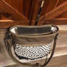 "Patterned Shoulder BAG Up-cycled from Canvas, Rug, and Leather 14.5\"w x 4\"d x 11.5\"h ; 23.5\" strap adjustable The canvas that these fashionable bags are made out of is smooth and breathable. Fully lined interior with 2 slip pockets and one zip pocket Front has one large zip pocket Back has a zip pocket. This bag is made of up-cycled materials including canvas and leather. Natural vegetable tanning processes are used. Each bag is handcrafted with the spirit of vintage with a bold look. S-201 Everyday Canvas Crossbody Bag With Handles, Canvas Crossbody Bag With Cell Phone Pocket, Tote Shoulder Bag With Cell Phone Pocket For Errands, Canvas Tote Shoulder Bag With Cell Phone Pocket, Rectangular Canvas Shoulder Bag With Cell Phone Pocket, Rectangular Canvas Bag With Cell Phone Pocket, Rectangular Satchel With Cell Phone Pocket For Errands, Bucket Bag With Cell Phone Pocket For Everyday Use, Everyday Bucket Bag With Cell Phone Pocket