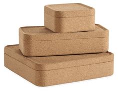 three cork coasters stacked on top of each other in front of a white background