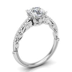 a white gold engagement ring with an intricate design