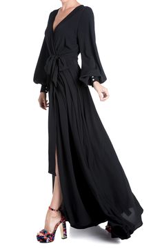 Made from lightweight opaque pebbled fabric, this maxi dress features a sweeping circle maxi skirt with a dramatic front thigh slit, perfect for making a show-stopping entrance. 56" length (size Small) Surplice V-neck Long sleeves 100% polyester with 100% rayon lining Dry clean Imported Circle Maxi Skirt, Hoco Inspo, The Maxx, Retro Glamour, Fashion District, Medium Dress, Vintage Vibe, Maxi Wrap Dress, Balloon Sleeves