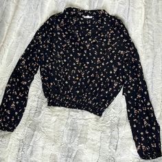 Women’s Button Up Crop Shirt -Black With Pink And White Flowers Size Large Two Faux Breast Pockets Shoulder Buttons Wide Elastic Waist New With Tags Black Collared Blouse With Floral Print, Casual Black Tops With Buttons, Black Collared Top With Floral Print, Black Collared Floral Print Top, Black Floral Print Collared Top, Black Collared Tops With Button Closure, Black Button-up Casual Top, Black Collared Top For Spring, Black Floral Print Shirt For Fall