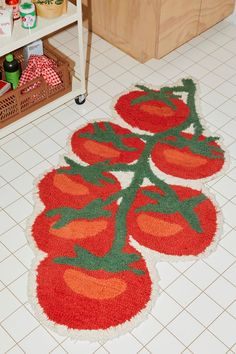 a kitchen floor mat with tomatoes on it