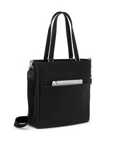 In supple leather, this tote balances form and function with pockets dedicated for each of your necessities, streamlining your day-to-day. It comes with a detachable pouch for on-the-go touch-ups essentials. Travel Products, North South, Tech Accessories, Wallets, Pouch, Things To Come, Leather, Travel