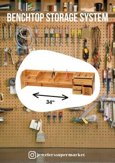 the benchtop storage system is shown with three drawers and two pegs on it