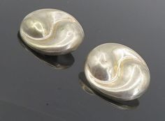 "MEXICO 925 Sterling Silver - Vintage Hollow Swirl Non Pierce Earrings - EG4580  MEXICO 925 Sterling Silver - Vintage Hollow Swirl Non Pierce Earrings - EG4580  Jewelry Type:         Earrings   Metal Type:            925 Silver  Metal Size:             1.25\"  Stone Type:            N/A  Condition:              N/A  Jewelry Weight:     14.3 Grams  PLEASE NOTE: THIS ITEM IS PRE-OWNED. ALTHOUGH MOST ITEMS ARE IN VERY GOOD CONDITION, SOME MAY NEED CLEANING AND/OR MINOR REPAIRS. WE MAKE A VERY STRONG EFFORT TO UPLOAD CLEAR PICTURES. PLEASE INSPECT ALL PICTURES AND ASK ALL QUESTIONS YOU MAY HAVE PRIOR TO MAKING A PURCHASE. NOT ALL STONES ARE GENUINE, SOME ARE ENHANCED OR CREATED." Earrings Metal, Earings Piercings, Types Of Metal, Metallic Silver, Swirl, 925 Silver, Fashion Jewelry, Jewelry Earrings, 925 Sterling Silver