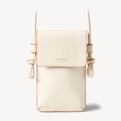 Ella Phone Pouch in Ivory Pebble | Aspinal of London Luxury Everyday Phone Bag With Adjustable Strap, Beige Leather Phone Bag With Removable Pouch, White Leather Phone Bag With Removable Pouch, Beige Leather Crossbody Phone Bag, Beige Leather Phone Bag With Adjustable Strap, Luxury Beige Phone Bag For Travel, Luxury Beige Phone Bag For Everyday, Beige Leather Phone Bag For On-the-go, Beige Leather Phone Bag With Detachable Strap