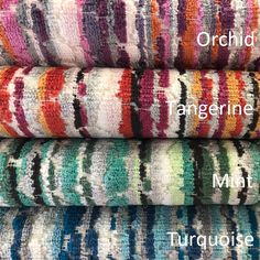 four different colored towels stacked on top of each other with the words, orchd tangerine and mint