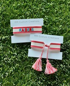 One size fits all,  white cotton/poly bracelet with red trim.   RAIDERS is embroidered in red and baby blue and was made for Archbishop Rummel High School.   Bracelet self ties. Adjustable White Friendship Bracelets For Game Day, White Embroidered Bracelets For Friendship, White Embroidered Bracelet As Gift, School Team, Tassel Bracelet, Braided Bracelets, Custom Creations, Friendship Bracelets, Tassels