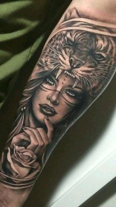 a woman with a tiger and roses tattoo on her arm