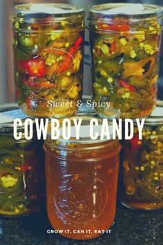 four jars filled with pickles and peppers on top of a counter next to the words, sweet & spicy cowboy candy