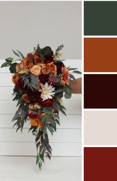 a bouquet of flowers sitting on top of a table next to a color swatch